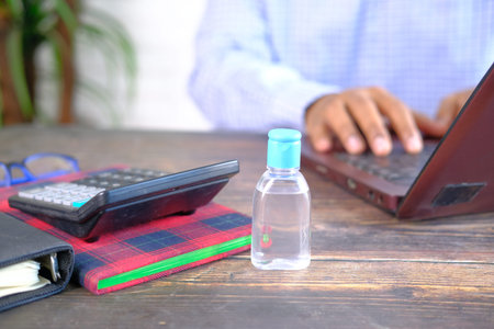 close up of hand sanitizer on office deskの写真素材