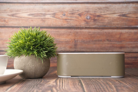 smart speaker and keyboard with copy space on wooden backgroundの写真素材