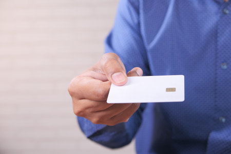 hand holding credit cards reading informationの写真素材