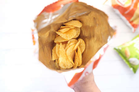 tasty potato chips in a packet top downの写真素材