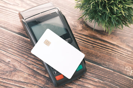 contactless payment concept with young man paying with credit cardの写真素材