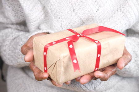 senior women hand holding gift box