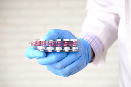 doctor hand holding blister pack close up