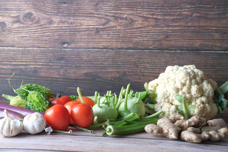Healthy food selection with fresh vegetables on table with copy spaceの写真素材