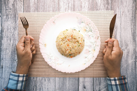 hand holding cutlery waiting for eating food