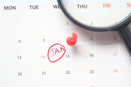 tax day concept with red circle on calendar dateの写真素材