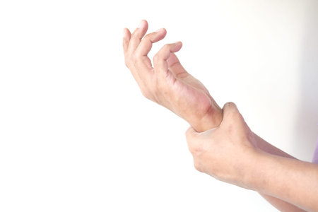 man suffering pain in hand close up