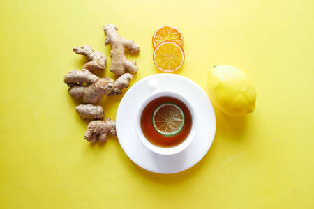Top view of ginger tea on wooden background.の写真素材