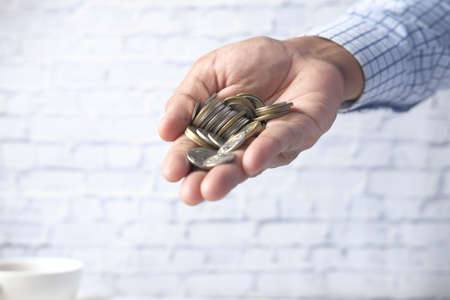 Close up of man hand counting coinsの写真素材