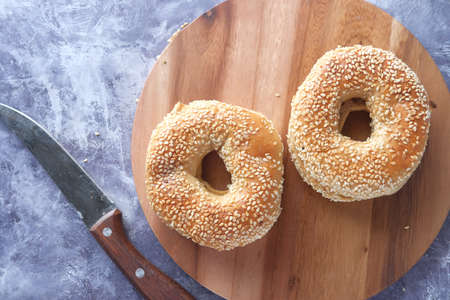 fresh bagel bread in a paper on tableの写真素材