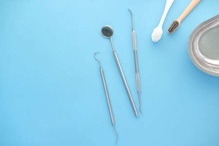 top view of dental equipment on blue backgroundの写真素材