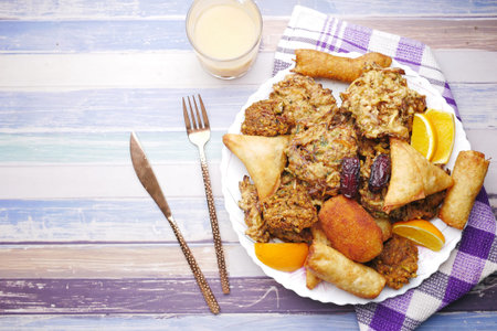 high angle view of iftar on plate on table during ramadan