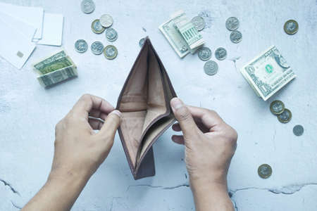 Man hand open an empty wallet with copy space.の写真素材