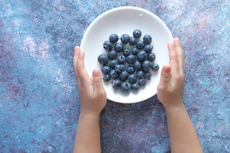 Close up of fresh blue berry with water drops .の写真素材