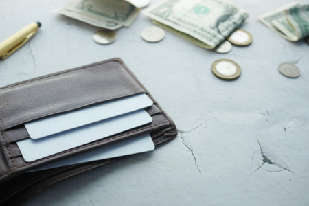 close up of credit cards on wallet on white background