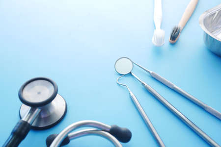 close up of dental equipment , stethoscope on blue backgroundの写真素材