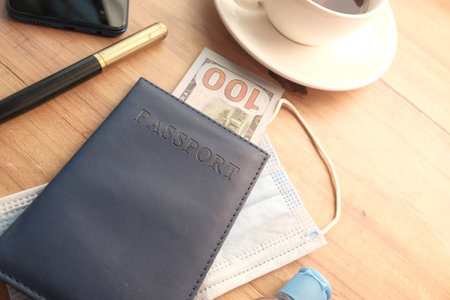 protective mask, map and blue color passport on tableの写真素材