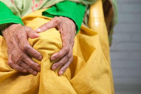 Close up on senior women suffering knee joint painの写真素材