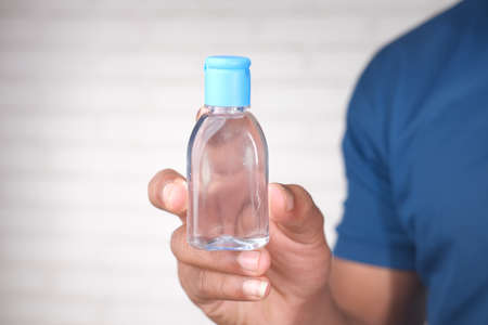 Using sanitizer liquid for preventing corona virusの写真素材