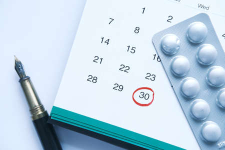 pills of blister pack on calendarの写真素材