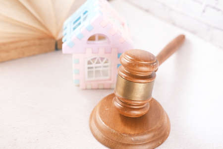 property law concept with gavel and book with copy space on tableの写真素材