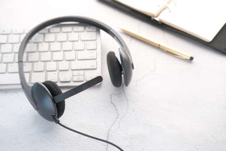 call center headphone on laptop on table ,の写真素材