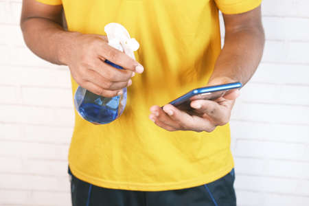 man hand cleaning mobile phone displayの写真素材