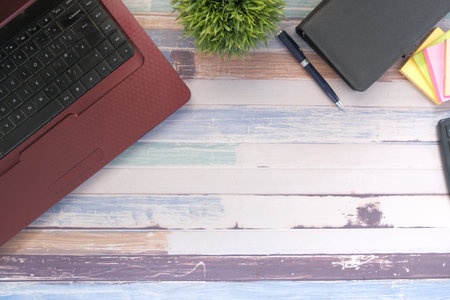 modern office desk with laptop and stationary on tableの写真素材