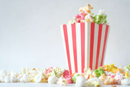 popcorn in a bowl on wooden desk with copy spaceの写真素材