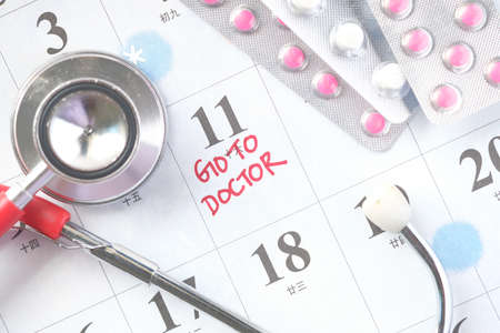 pills of blister pack on calendarの写真素材
