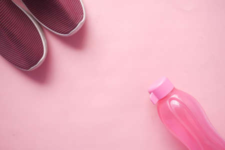 top view of water in pink color plastic bottleの写真素材