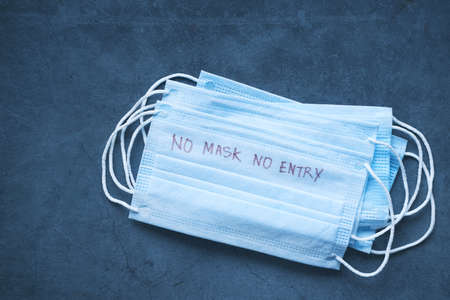 Close up of blue surgical masks on tableの写真素材