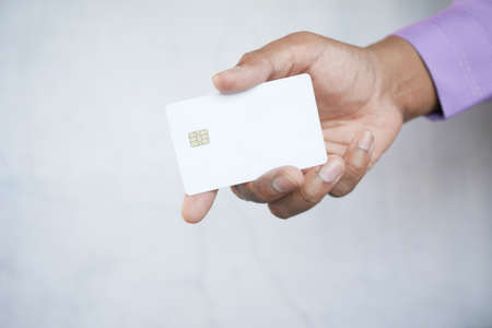 close up of person hand holding credit cardの写真素材