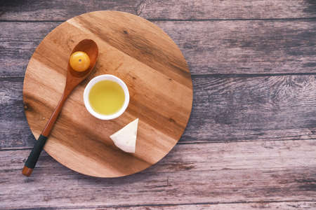 cherry tomato, cheese and olive oil on tableの写真素材