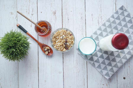 cereal breakfast in bowl ,bread and honey on white backgroundの写真素材