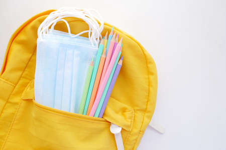 Student school bag pack with sanitizer, a face mask.の写真素材