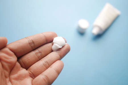 Man applying antibiotic cream close upの写真素材