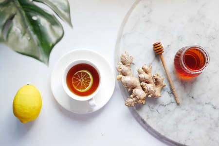 top view of herbal tea and ingredient on tableの写真素材