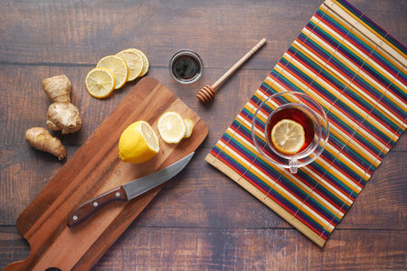 Top view of ginger and lemon tea on wooden background.の写真素材