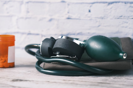 blood pressure machine and medical pill on table .の写真素材