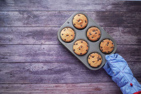muffin and baking tray on tableの写真素材