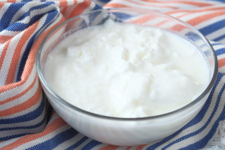 fresh yogurt in a bowl on table