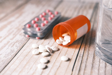 white color medical pills spilling on table
