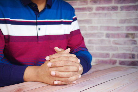 a nervous young man hand