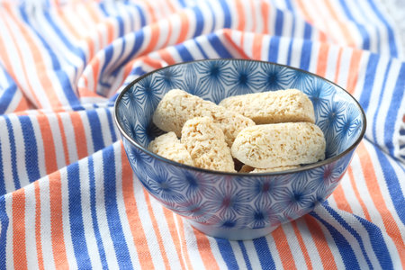 Tasty oats bars in a bowl on tableの写真素材