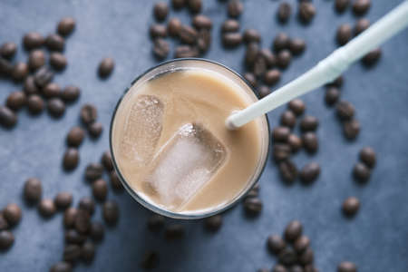 ice coffee in a tall glass on black background.の写真素材
