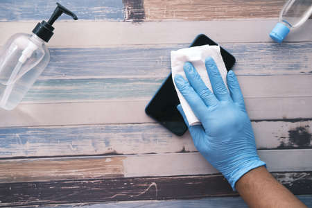cleaning mobile phone display for preventing virusの写真素材