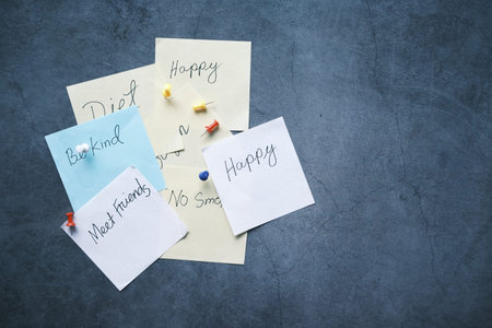 new year goals on a sticky note on table ,