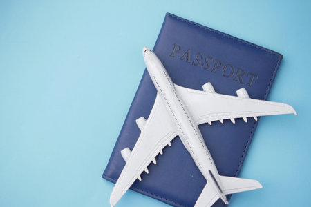 top view of passport and plate on table with copy space