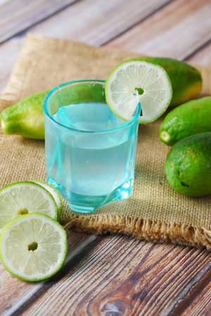 Refreshing lemon water drink on table , top view